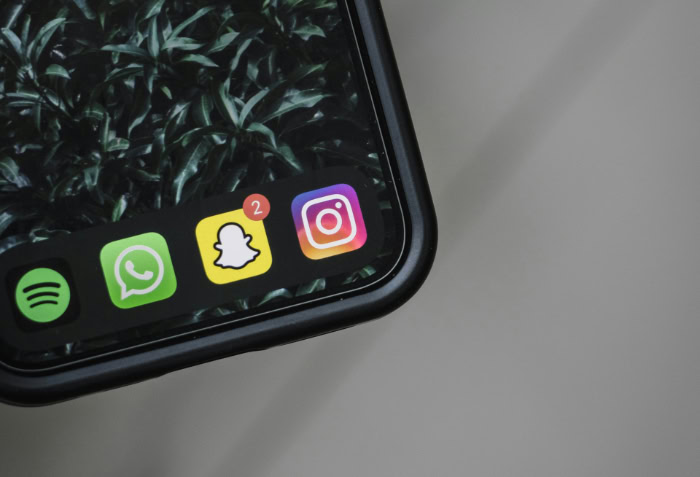 Phone screen showing Snapchat app icon with notifications