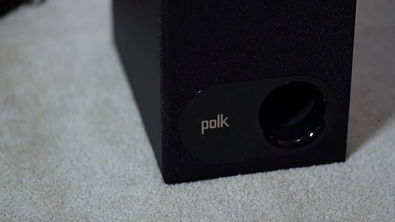 Black Polk Signa S2 subwoofer on gray carpet