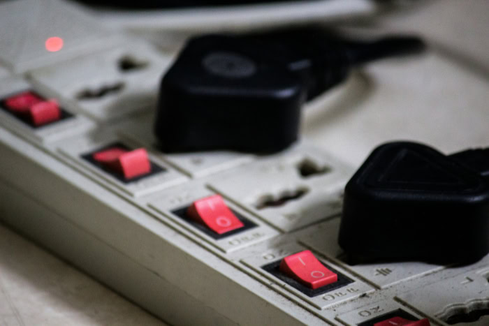 Power strip with multiple individual red switches