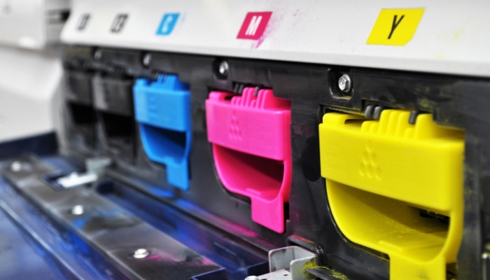 Printer with open cyan magenta yellow and black toner compartments