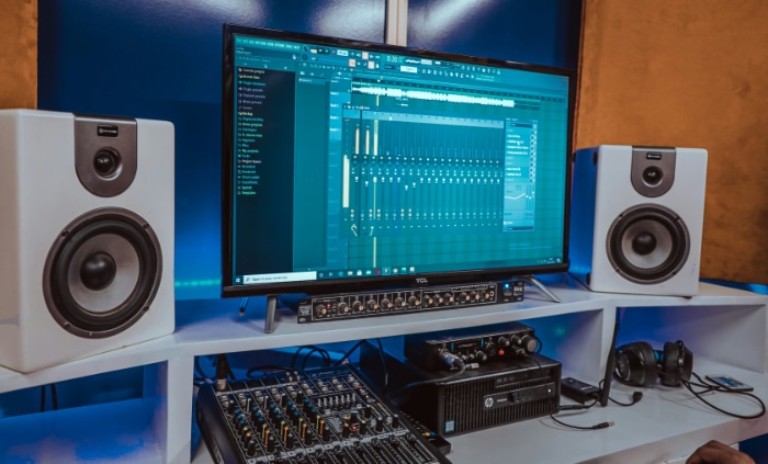 Professional audio setup with DAW software and mixing console