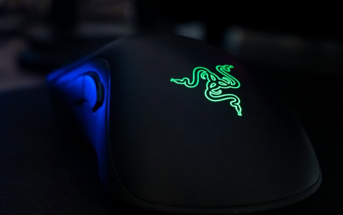Razer gaming mouse with illuminated green logo