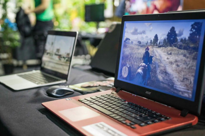 Red Acer laptop playing Red Dead Redemption 2