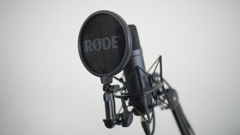 Rode condenser microphone with pop filter on stand