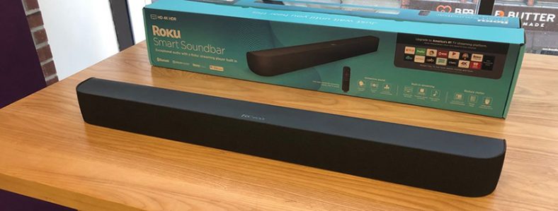 Black Roku Smart Soundbar on wooden table