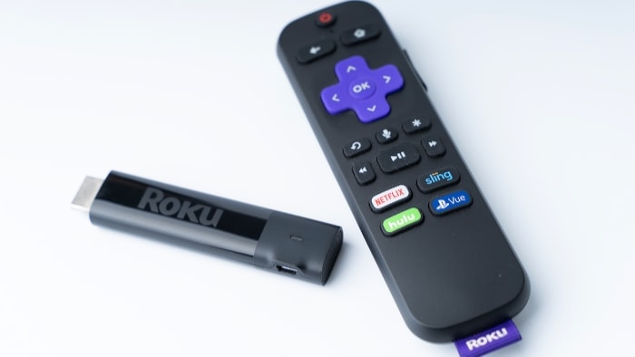 Roku and Roku remote on white surface