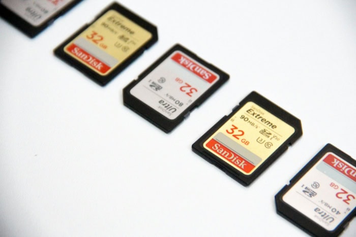 Row of SanDisk SD cards on white background