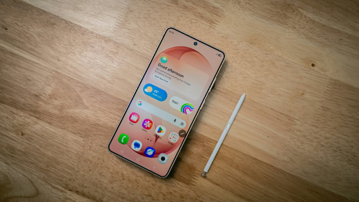 Samsung Galaxy smartphone and S Pen on wooden table