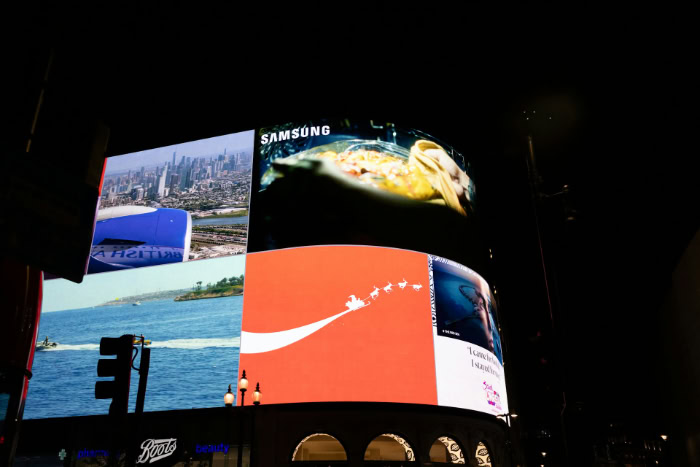 Samsung advertisement on large digital billboards at night