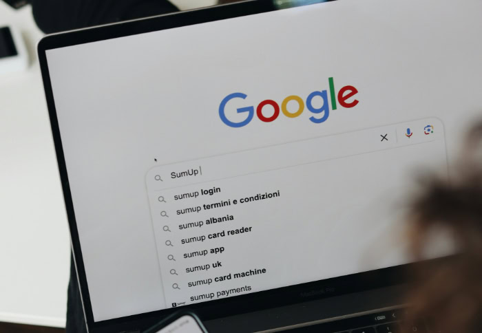 Searching SumUp on Google with laptop