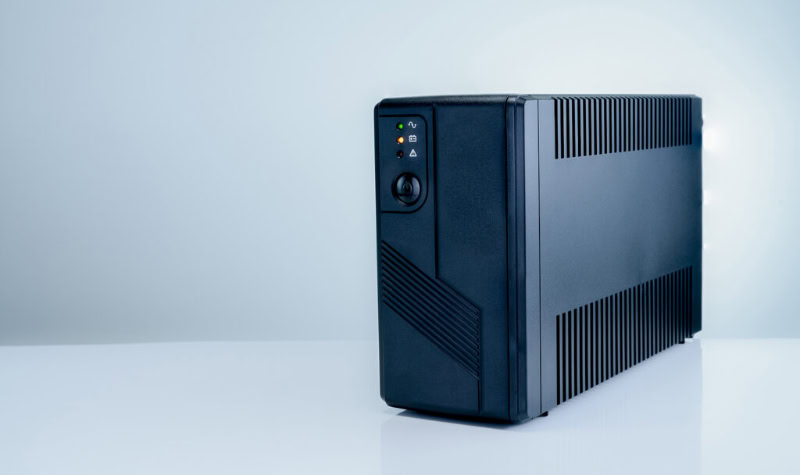Side view of a black UPS battery backup unit
