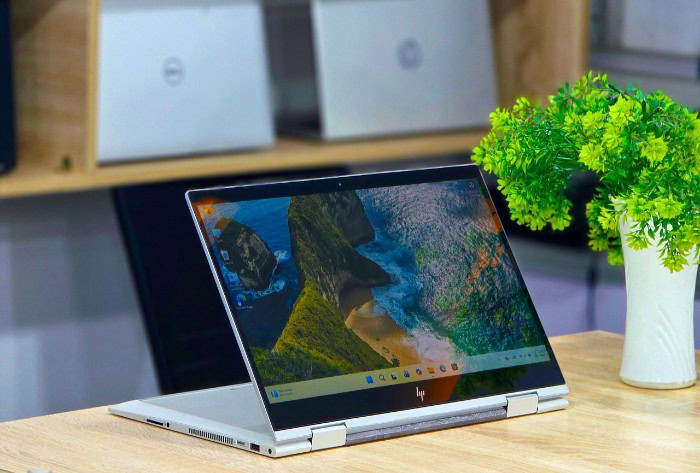 Silver HP Envy x360 laptop open on desk