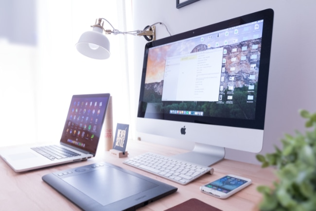 Silver iMac near iPhone and Macbook