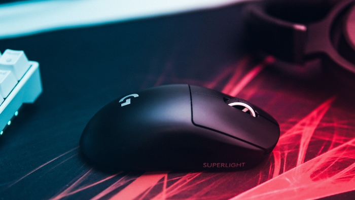 Sleek black gaming mouse with logo illuminated