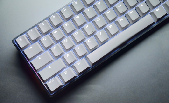 Sleek mechanical keyboard with white keys and blue LED backlighting