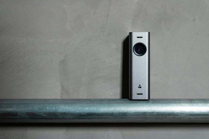 Sleek silver video doorbell camera on metal pipe