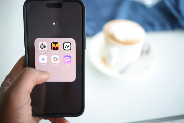 Smartphone displaying AI chatbot app icons collection