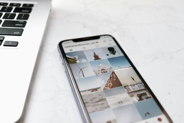 Smartphone displaying Instagram travel photo grid