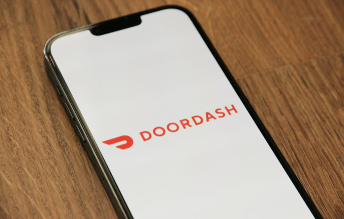 Smartphone displaying the red DoorDash app logo