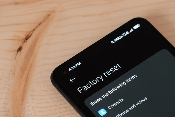 Smartphone screen displaying factory reset menu in dark mode