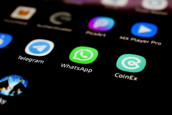 Smartphone screen showing WhatsApp Telegram and other app