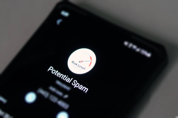 Smartphone screen showing potential spam call alert