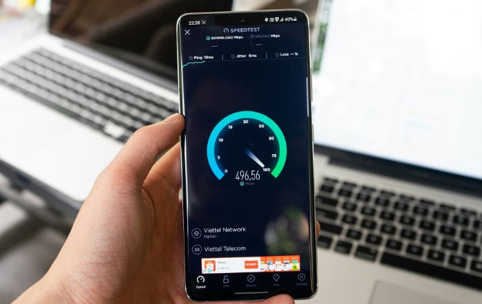 Smartphone showing Speedtest app with high speed internet result