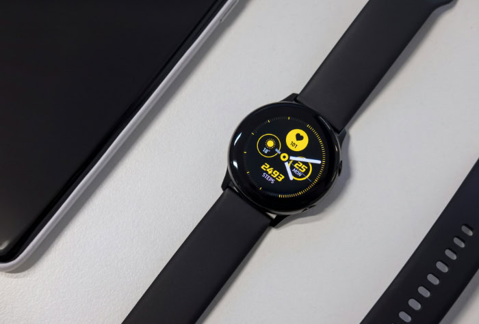 Smartwatch with fitness tracking face and black band