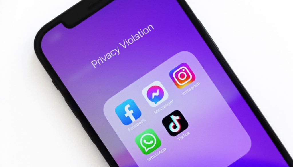 Black smartphone showing social media apps