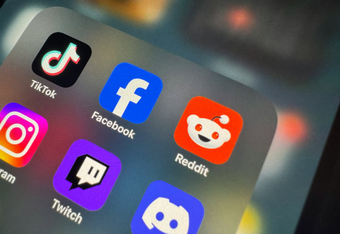 Social media app icons on smartphone screen display