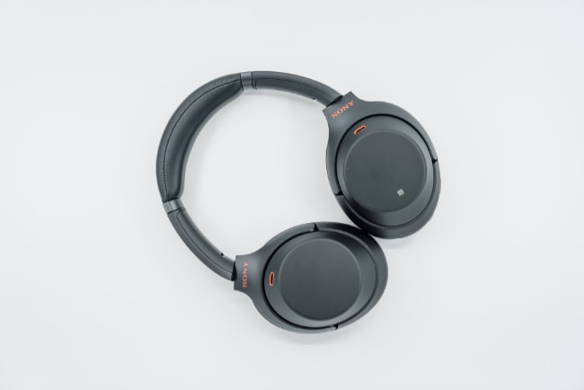 Sony WH-1000MX3 headphones on white surface