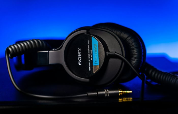 Sony professional headphones on blue background