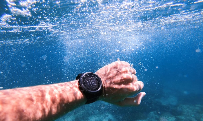 Sport watch on hand under water