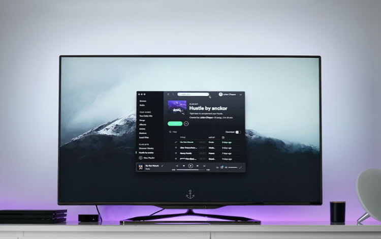 Spotify music playlist interface displayed on large TV screen