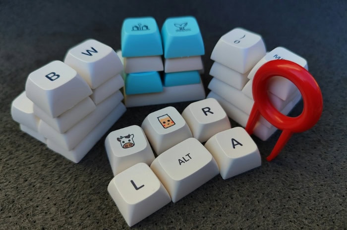 Stacked custom keycaps with a keycap puller tool