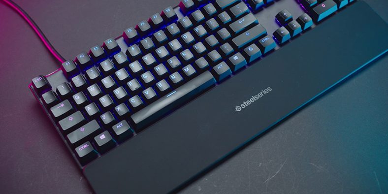 Black SteelSeries Apex Pro on black surface