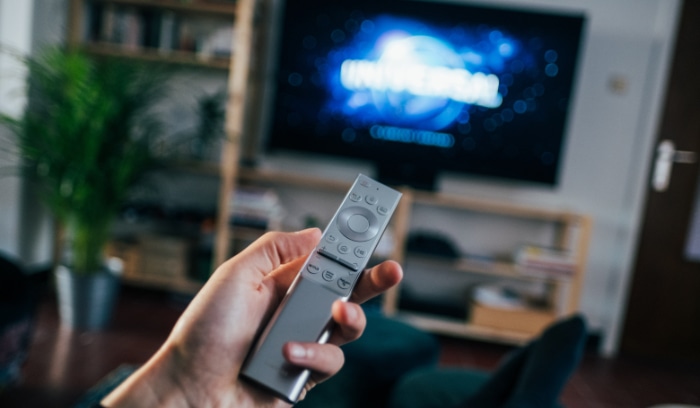 Silver remote tv on hand