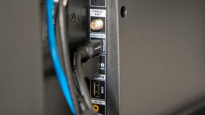 TV rear panel showing Optical Audio and HDMI ARC ports