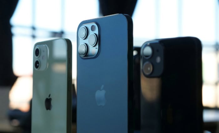 Three iPhone models showcasing different camera and colors