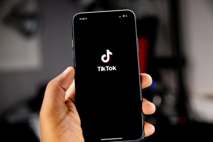 TikTok logo displayed on smartphone loading screen closeup