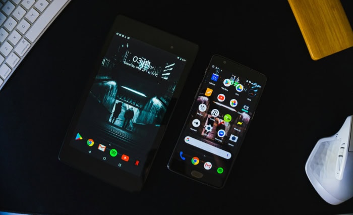 Two Android devices showing dark themed interfaces