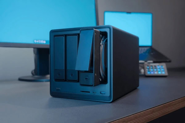 Ugreen DXP4800 NAS device with open hard drive tray resized