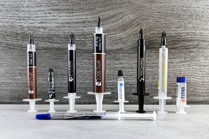Various thermal paste brands in syringe packaging