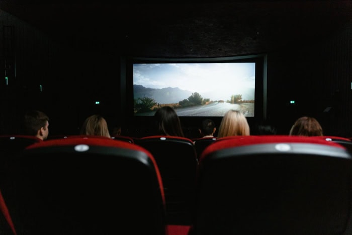 View of a movie theater screen and audience