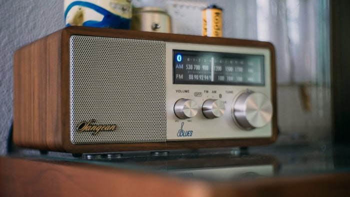 Vintage AM FM radio with tuner and volume controls