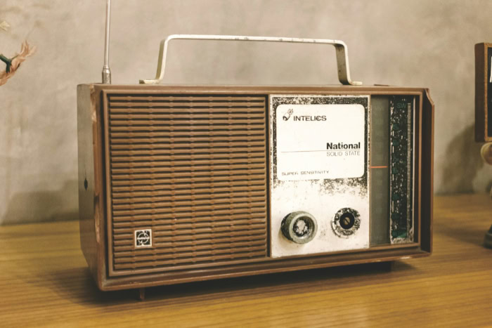 Vintage National Solid State radio on wooden table