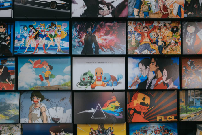 Wall display featuring various popular anime series posters