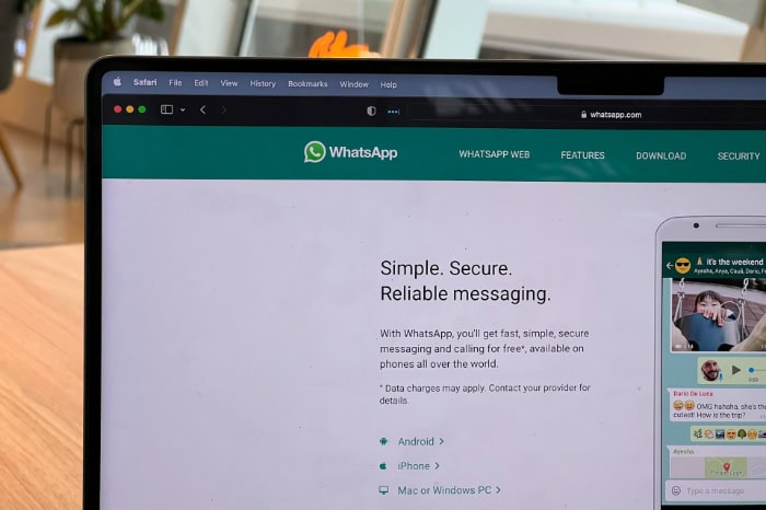 WhatsApp homepage on laptop screen showing secure messaging