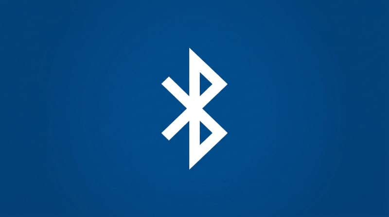 White Bluetooth logo on a solid blue background