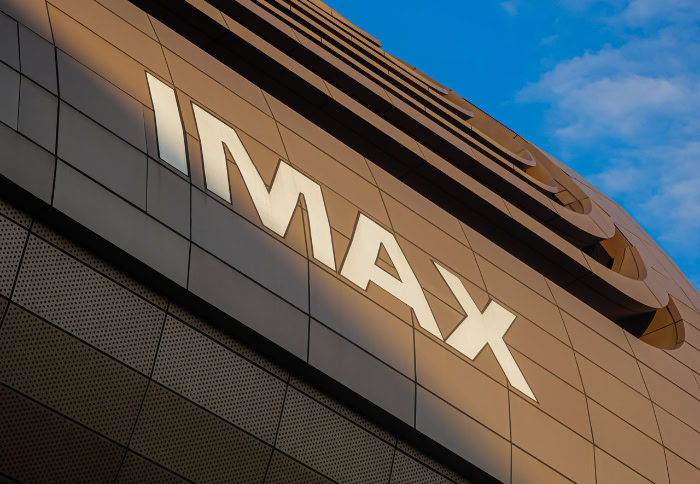 White IMAX logo on a modern building